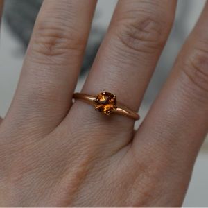 1960s Edwardian Revival 10k rose gold ring with amber glass stone.